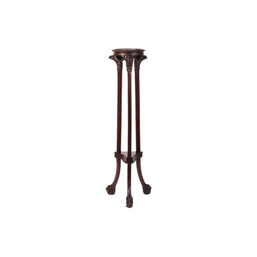 64 - A Neoclassical style carved mahogany torchere, in the manner of Duncan Phyfe, with a circular dished... 