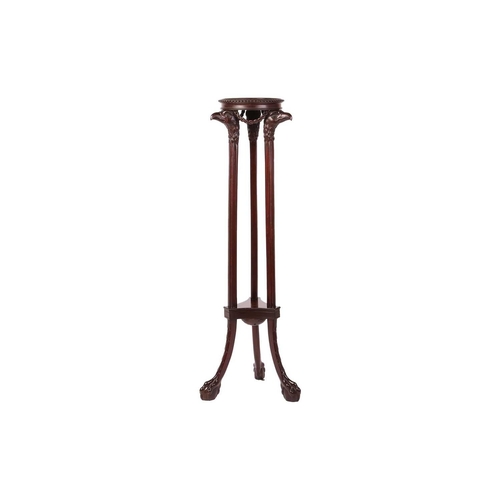 64 - A Neoclassical style carved mahogany torchere, in the manner of Duncan Phyfe, with a circular dished... 