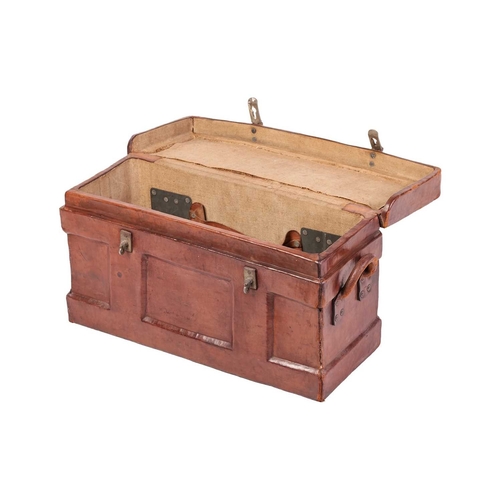 67 - An early 20th-century military, two-handled rectangular leather-clad magazine chest with a fitted in... 