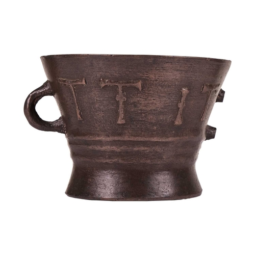 97 - A late Elizabethan heavy bronze leaded mortar, of waisted form, 14 cm high x 19 cm diameter.