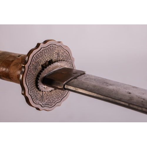176A - A Japanese type 95 Shin-Gunto sword and scabbard, fitted a cast one-piece tsuba, pigskin covered sca... 