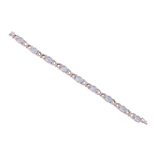 100 - An aquamarine and diamond-set bracelet, claw-set with nine oval mixed-cut aquamarines, of various si... 