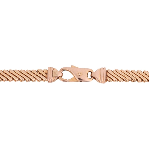 111 - A fancy link chain in 9ct yellow gold, comprising a series of flat crosshatched links, completed wit... 