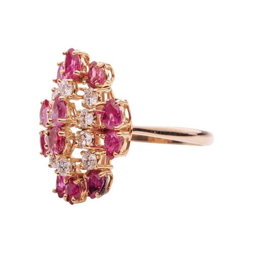 112 - A ruby and diamond cluster ring in 14ct yellow gold, the tiered ring head set with pear-cut rubies a... 