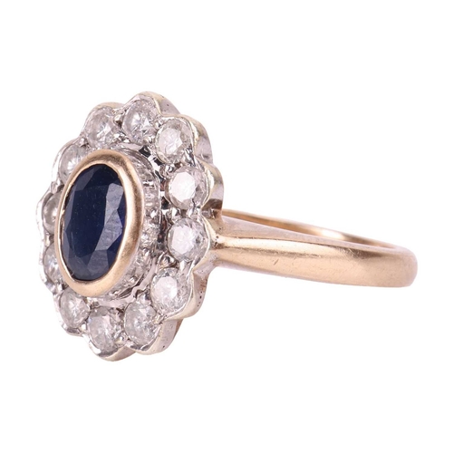 114 - A sapphire and diamond ring, collet-set with a central sapphire of deep blue colour, encircled by a ... 
