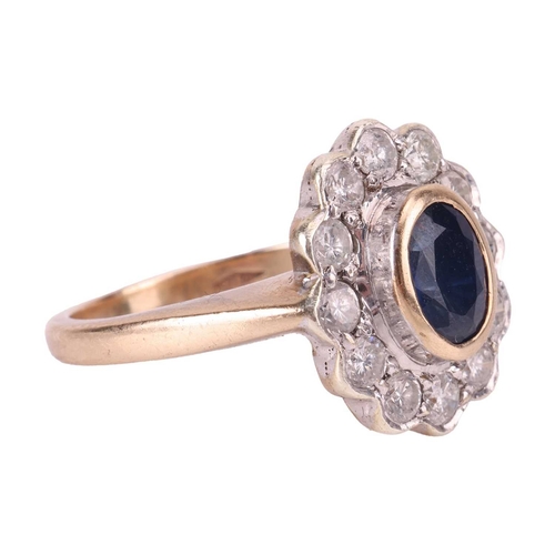 114 - A sapphire and diamond ring, collet-set with a central sapphire of deep blue colour, encircled by a ... 