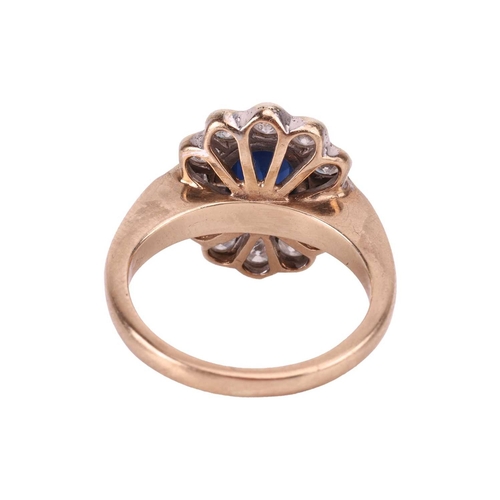 114 - A sapphire and diamond ring, collet-set with a central sapphire of deep blue colour, encircled by a ... 