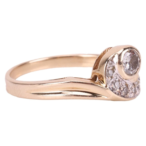 116 - A diamond-set dress ring, of asymmetrical swirl design, collet-set with a central brilliant-cut diam... 