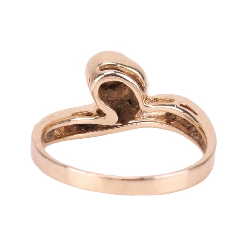 116 - A diamond-set dress ring, of asymmetrical swirl design, collet-set with a central brilliant-cut diam... 