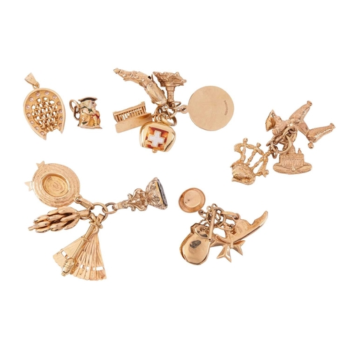 15 - A collection of charms and pendants, including a 9ct gold enamelled ‘toby jug’ charm, an articulated... 