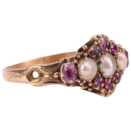 22 - A Victorian seed pearl and ruby ring, of cluster design, centred with three seed pearls, encircled b... 