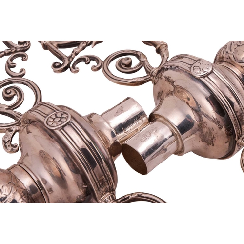 353 - A pair of Edwardian silver candelabra fittings, the two three light branches with scrolling arms and... 