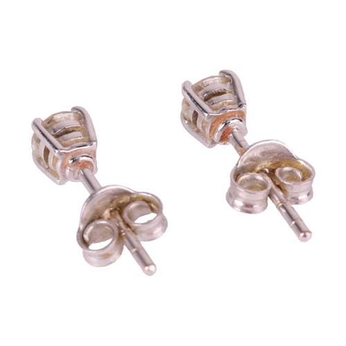 61 - A pair of diamond stud earrings in 18ct white gold, each consisting of a 3.7 mm round brilliant-cut ... 