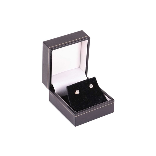 61 - A pair of diamond stud earrings in 18ct white gold, each consisting of a 3.7 mm round brilliant-cut ... 