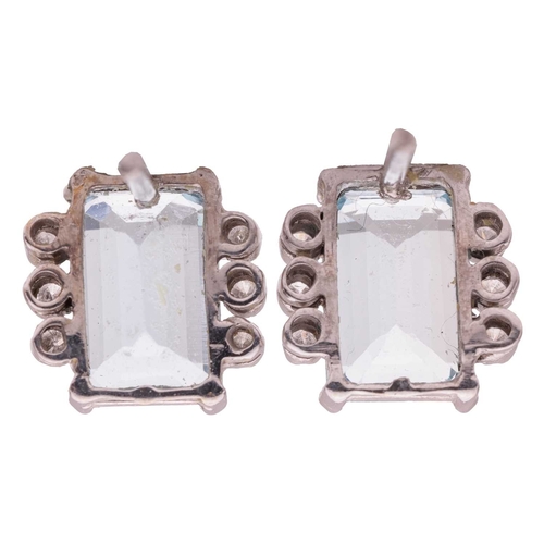 63 - A pair of aquamarine and diamond stud earrings, each contains a rectangular step-cut aquamarine of 9... 