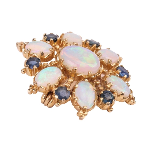 66 - An opal and sapphire cluster brooch in 9ct yellow gold, of floral form, constructed with seven oval-... 