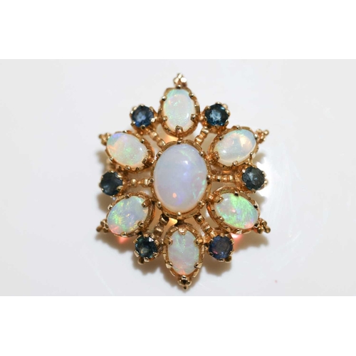 66 - An opal and sapphire cluster brooch in 9ct yellow gold, of floral form, constructed with seven oval-... 