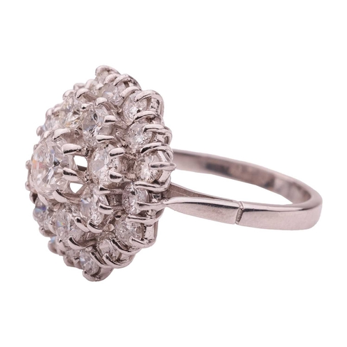 77 - A diamond-set cluster ring, set with twenty-five brilliant-cut diamonds with an estimated total cara... 