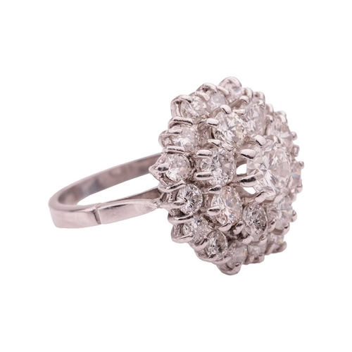 77 - A diamond-set cluster ring, set with twenty-five brilliant-cut diamonds with an estimated total cara... 