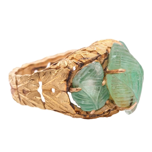 79 - Buccellati - a carved emerald dress ring of foliate design, circa 1950s, claw-set with three carved ... 