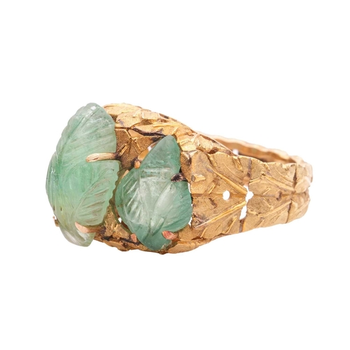 79 - Buccellati - a carved emerald dress ring of foliate design, circa 1950s, claw-set with three carved ... 