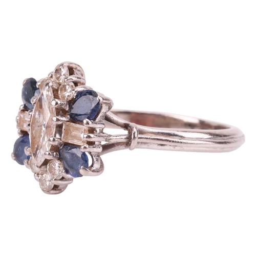 8 - A diamond and sapphire cluster ring, with an estimated diamond carat weight of 0.70ct, comprising a ... 