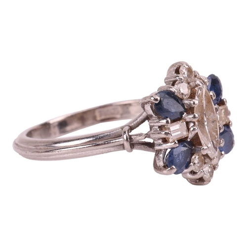 8 - A diamond and sapphire cluster ring, with an estimated diamond carat weight of 0.70ct, comprising a ... 