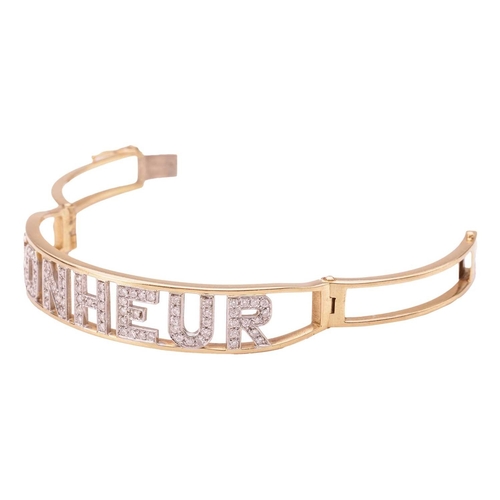 85 - A diamond-set 'Bonheur' (Happiness in French) hinged bangle, alphabets encrusted with brilliant-cut ... 