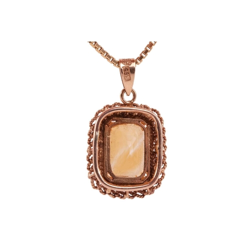 87 - A citrine pendant on chain, featuring a rectangular step-cut citrine with canted corners, 12.2 x 8.0... 