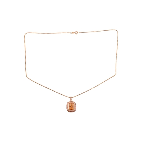 87 - A citrine pendant on chain, featuring a rectangular step-cut citrine with canted corners, 12.2 x 8.0... 