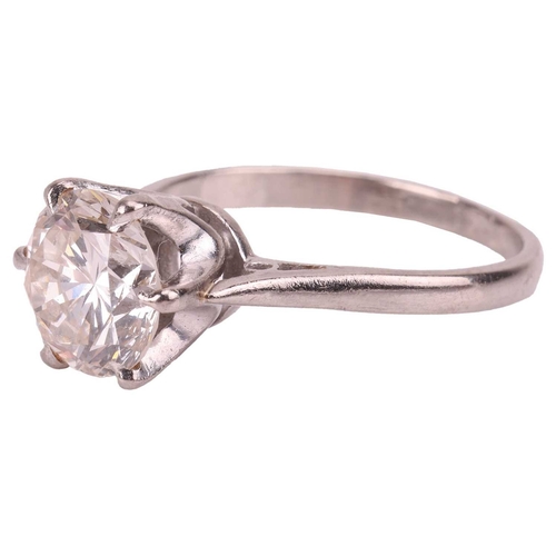 92 - A diamond solitaire ring, featuring a round brilliant-cut diamond of 2.57ct, claw-set between tapere... 