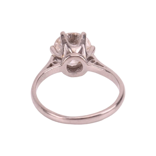 92 - A diamond solitaire ring, featuring a round brilliant-cut diamond of 2.57ct, claw-set between tapere... 