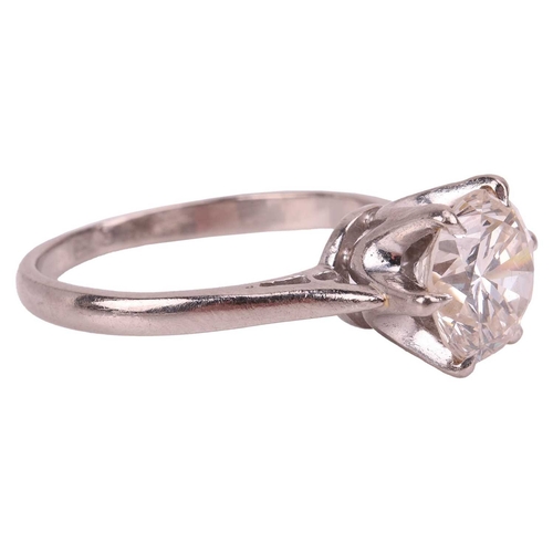 92 - A diamond solitaire ring, featuring a round brilliant-cut diamond of 2.57ct, claw-set between tapere... 