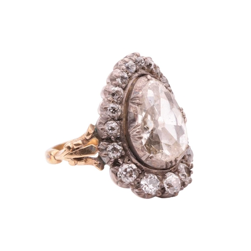96 - An old-cut diamond cluster ring, centred with a pear-shaped old-cut diamond of approximately 12.6mm ... 