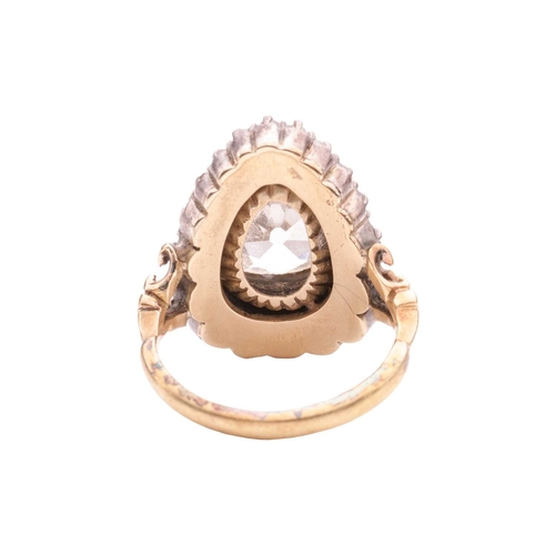 96 - An old-cut diamond cluster ring, centred with a pear-shaped old-cut diamond of approximately 12.6mm ... 