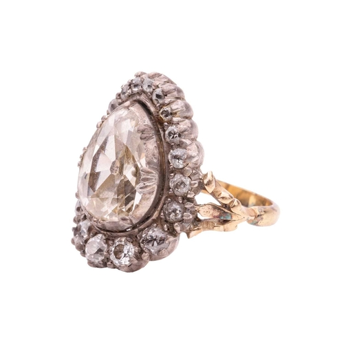 96 - An old-cut diamond cluster ring, centred with a pear-shaped old-cut diamond of approximately 12.6mm ... 