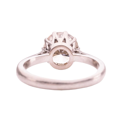 106 - A solitaire diamond ring, comprising a central claw-set round brilliant-cut diamond of estimated 2.0... 