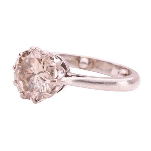 106 - A solitaire diamond ring, comprising a central claw-set round brilliant-cut diamond of estimated 2.0... 