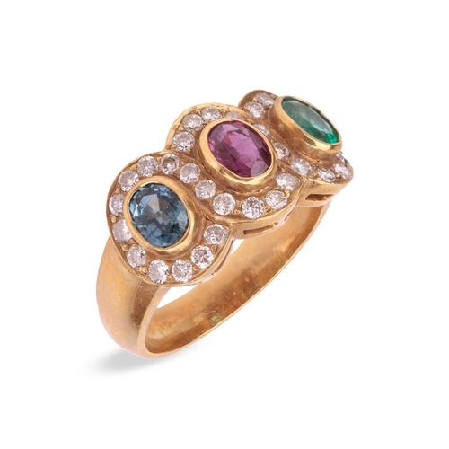 A multi-gem triple cluster ring, bezel-set with an oval-cut sapphire ...