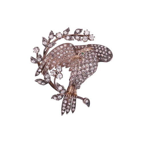 18 - A 19th-century diamond-set bird brooch, composed of a bird with spread wings, the body, wings and ta... 