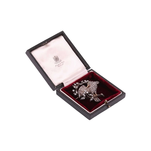 18 - A 19th-century diamond-set bird brooch, composed of a bird with spread wings, the body, wings and ta... 