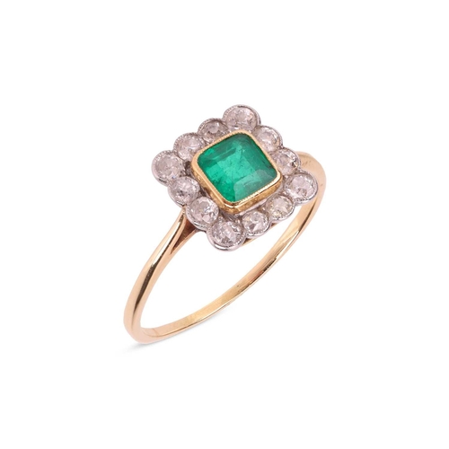 19 - An emerald and diamond cluster ring, comprising a central emerald-cut emerald collet-set in yellow m... 