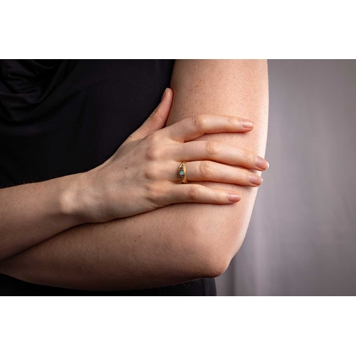 26 - An Edwardian opal and diamond-set half hoop ring, featuring a central opal cabochon, flanked by two ... 