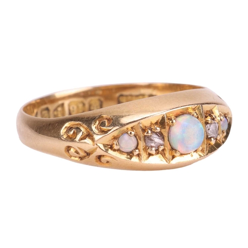 26 - An Edwardian opal and diamond-set half hoop ring, featuring a central opal cabochon, flanked by two ... 