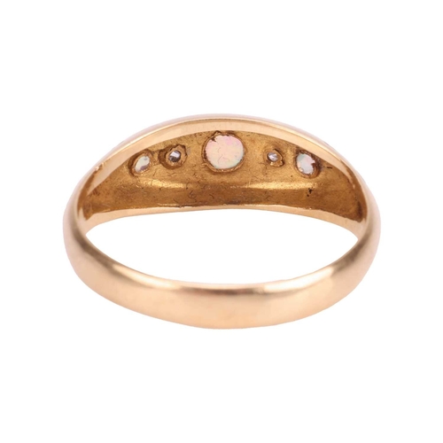 26 - An Edwardian opal and diamond-set half hoop ring, featuring a central opal cabochon, flanked by two ... 