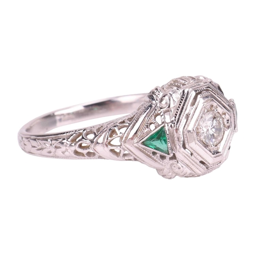 42 - An Art Deco-style ring, centrally-set with a round brilliant-cut diamond in a geometric setting with... 