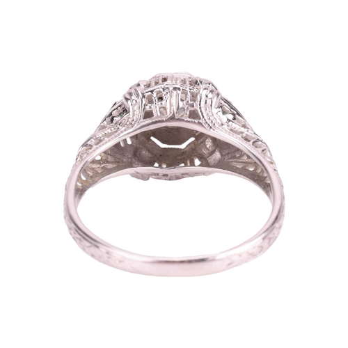 42 - An Art Deco-style ring, centrally-set with a round brilliant-cut diamond in a geometric setting with... 