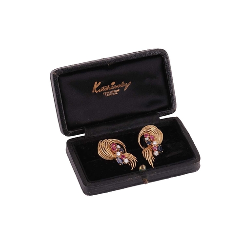 50 - Kutchinsky - A pair of gem-set clip-on earrings in 18ct yellow gold, the stylised sprays of swirl fo... 