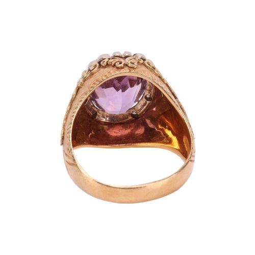 54 - Carl Bucherer - An amethyst dress ring, claw-set with an oval-cut amethyst of 11.0mm x 9.0mm, in a s... 