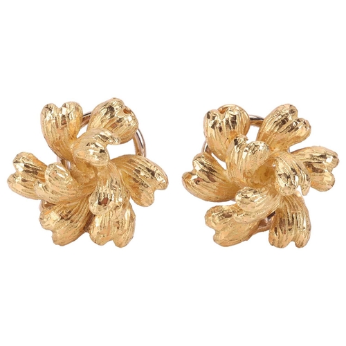57 - A pair of floral clip-on earrings in 18ct yellow gold, by Crinnan Jewellery Ltd, the stylised flower... 
